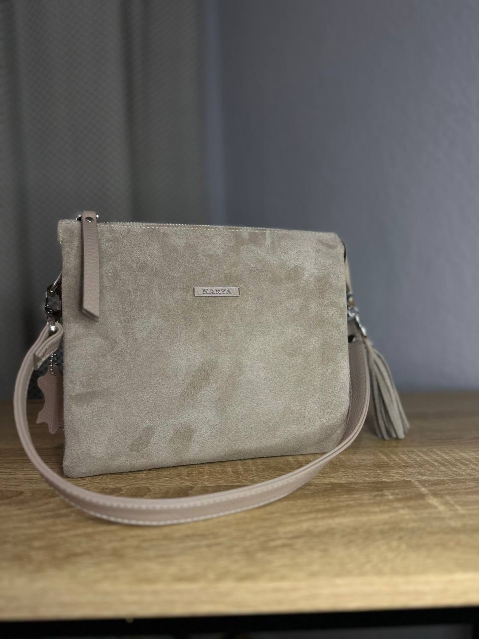 Elegant crossbody bag made of genuine suede in a powder-beige color