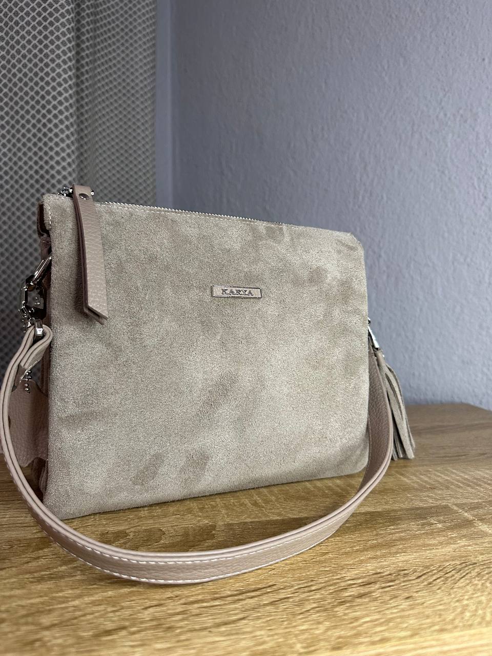 Elegant crossbody bag made of genuine suede in a powder-beige color