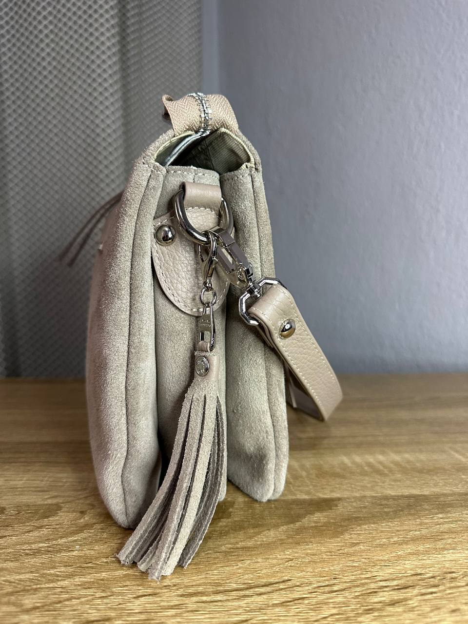 Elegant crossbody bag made of genuine suede in a powder-beige color