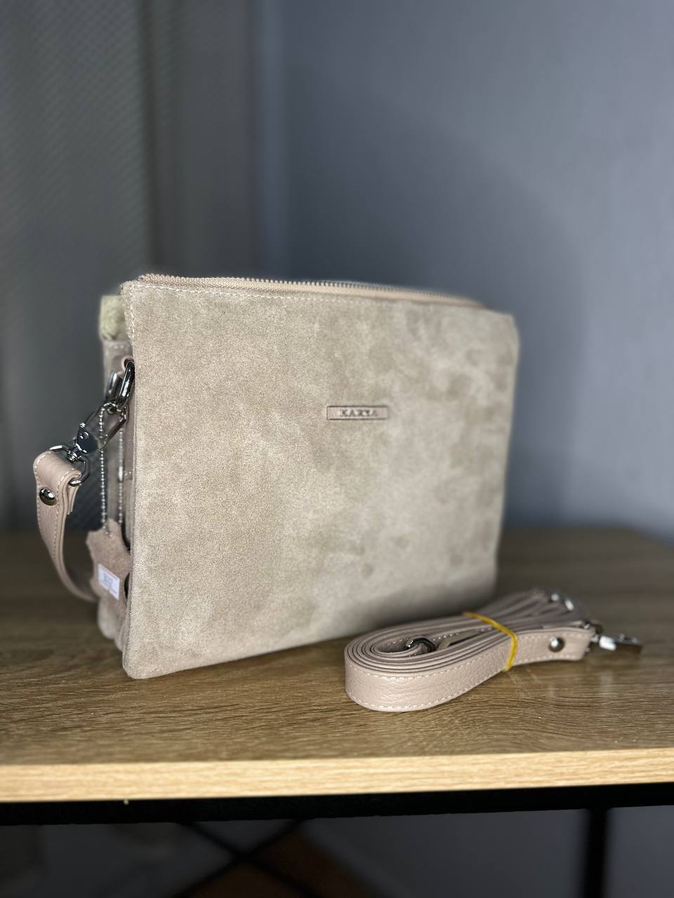 Elegant crossbody bag made of genuine suede in a powder-beige color